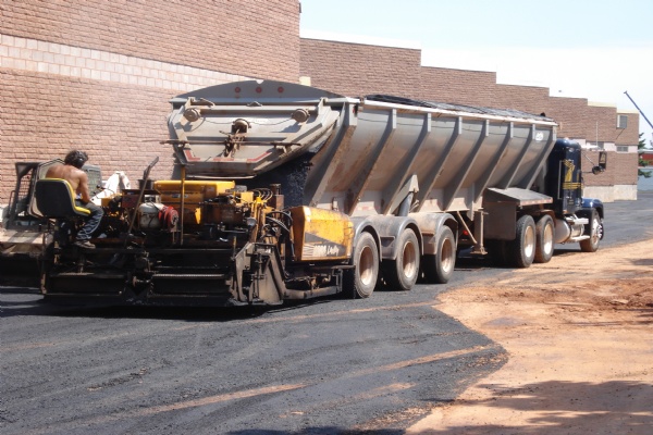 LEVEL & RESURFACE of a commercial parking lot.